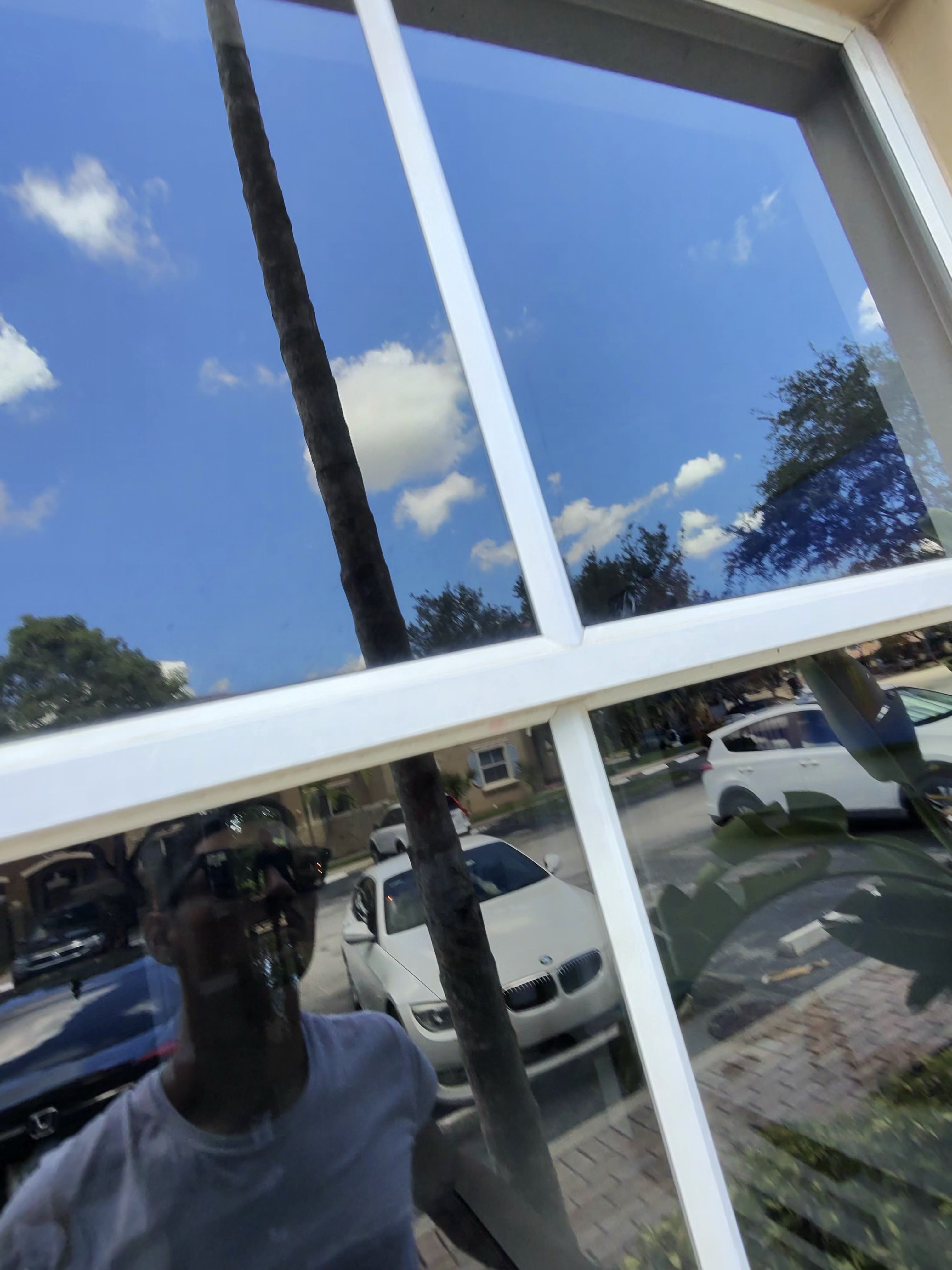 Close-up of a perfectly clean window reflecting the sky